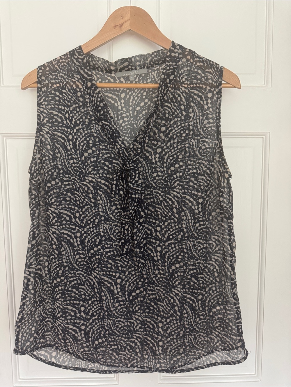 Sleeveless Black and Cream Printed V-Neck Blouse